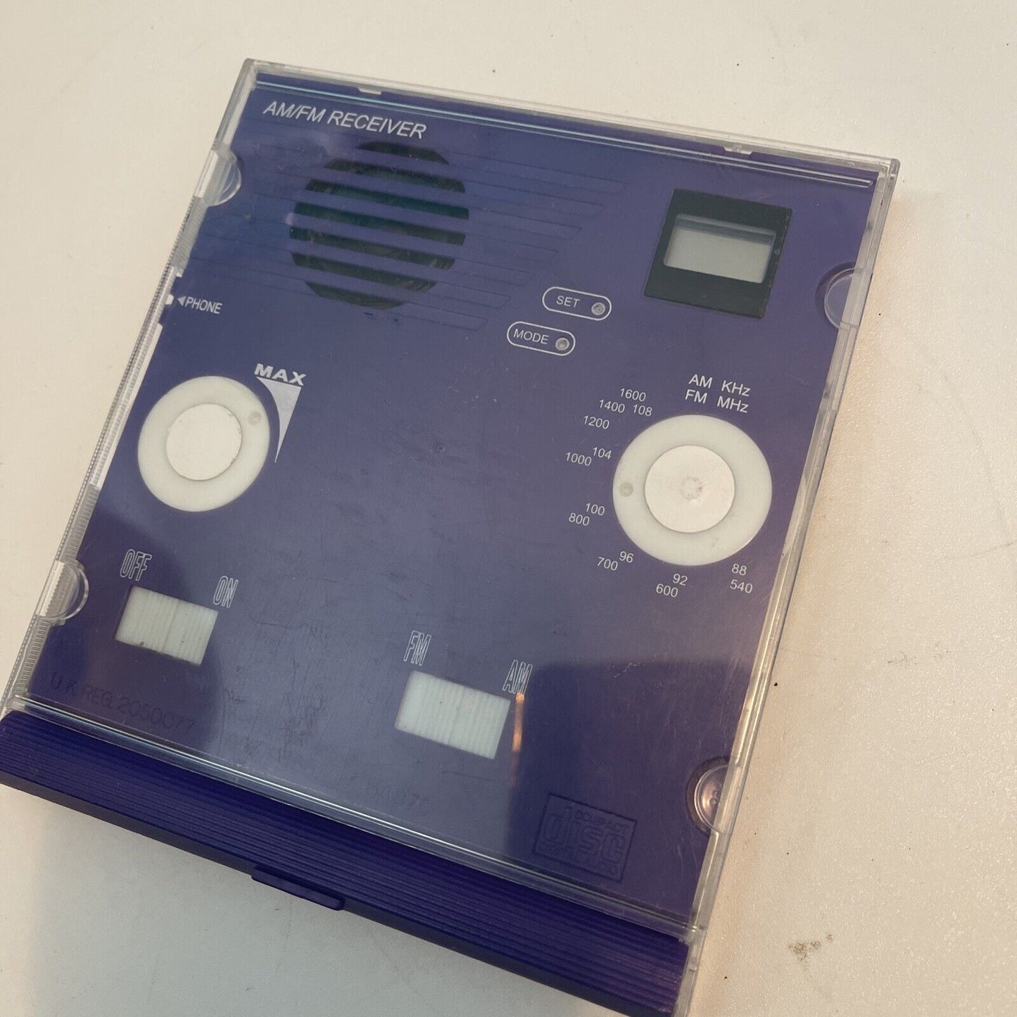 AM/FM Receiver in a Purple CD Jewel Case See through Clear