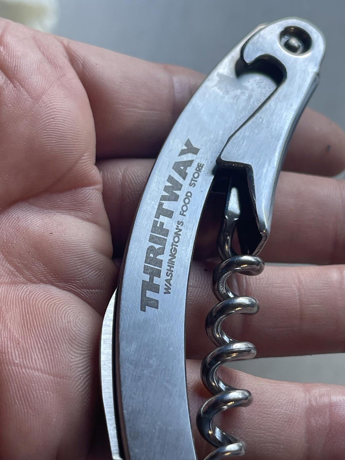 Multi purpose knife with corkscrew